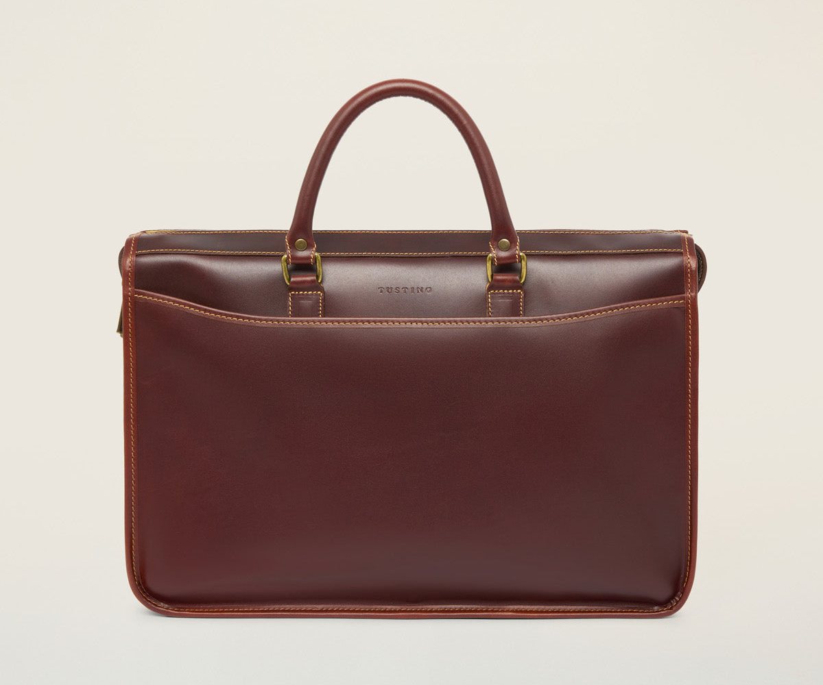Tusting Marston briefcase (Large) in Sundance leather, front view with twin top handles and a full-width front pocket